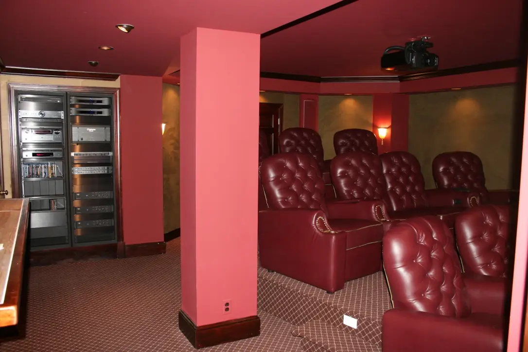 Plush theater seating with dedicated AV equipment rack in the demo theater