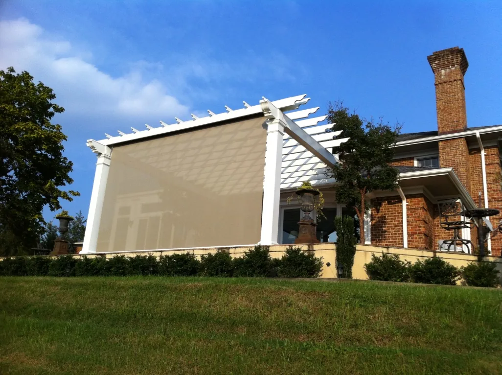 Pergola with drop-down sunscreen and hidden speakers