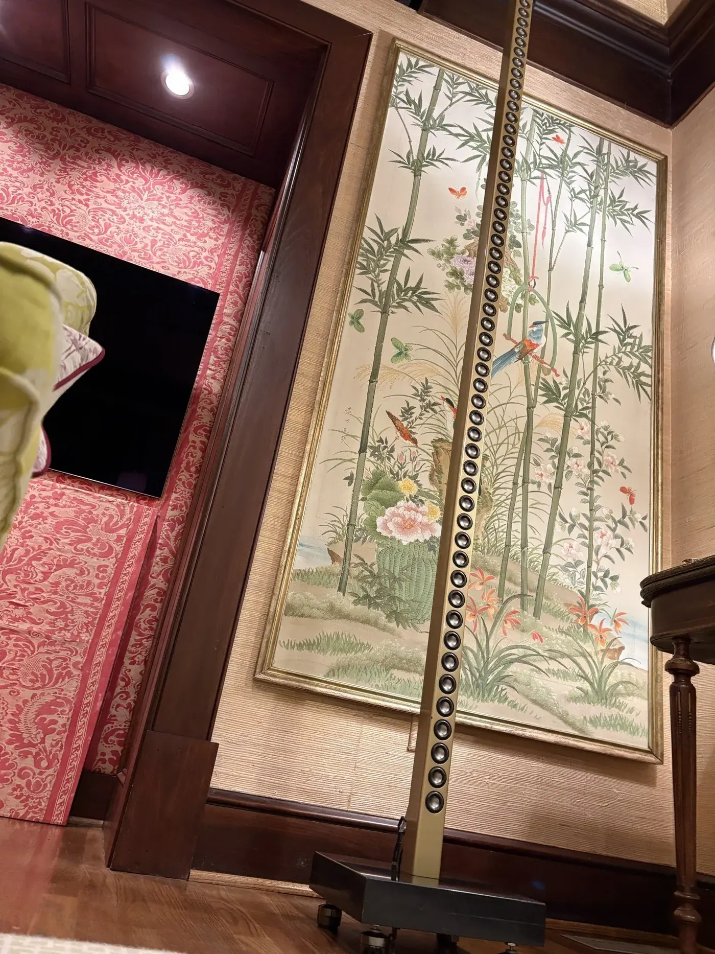 Floor-standing speaker next to artwork