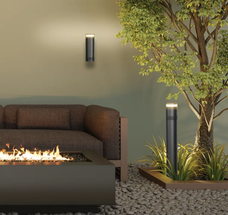 Wall and bollard outdoor speakers by fire pit