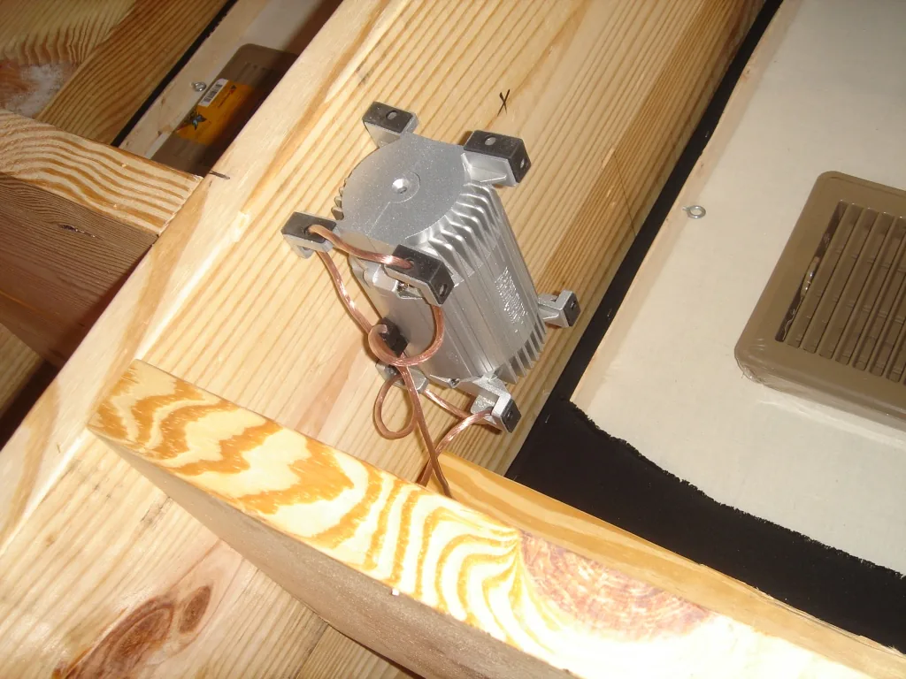 Floor transducer mounted between joists